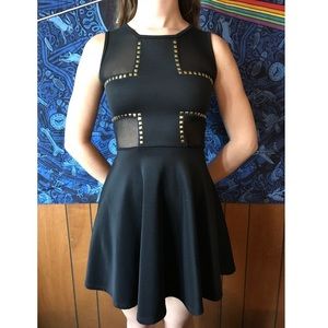 Black dress with gold studded accents and mesh